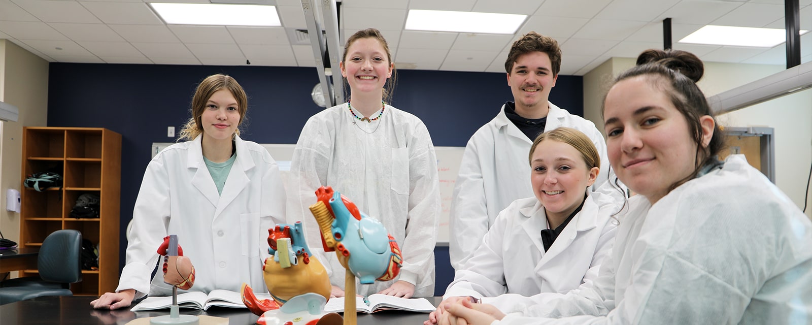 Students smiling in biology lab